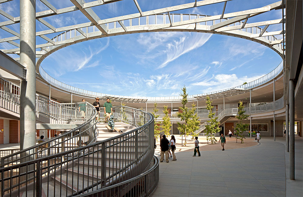 Image 6. Ground view of primary courtyard with curved staircase on the left.
